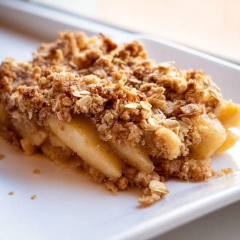 Golden-brown, crisp crumble topping covers juicy, tender spiced apples in this apple crumble.