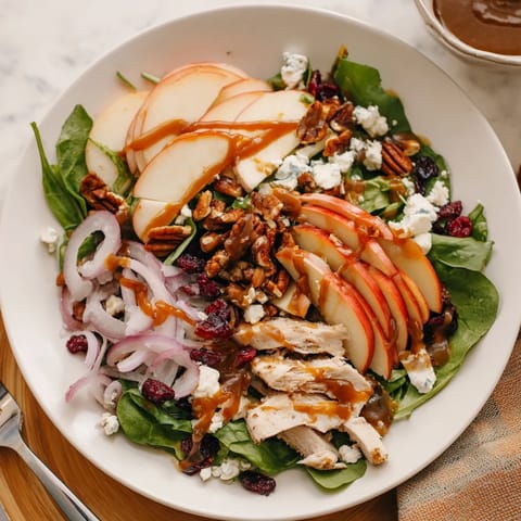 Fresh, crisp mixed greens topped with tender sliced chicken, thin apple slices, and crumbled feta cheese.