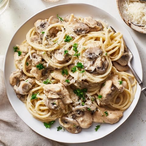 Creamy Mushroom Chicken Spaghettini features tender chicken breast and al dente pasta coated in a velvety, lighter mushroom cream sauce with fresh thyme.
